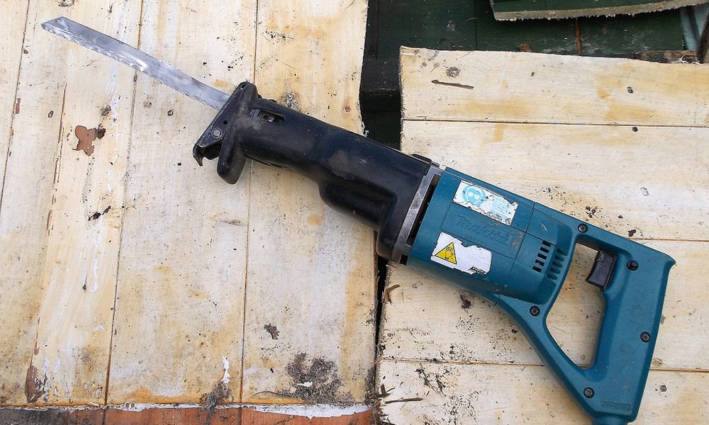 reciprocating saw on floor boards